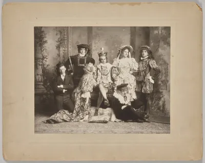 Untitled (theatrical scene with seven costumed figures)