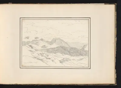 Vergezicht met bergen en gebouwen te Rocca Sinibalda