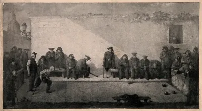 Veterans watching and participating in a game of bowls