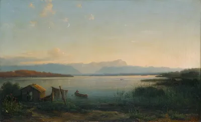 View of a lake with a man in a rowboat.