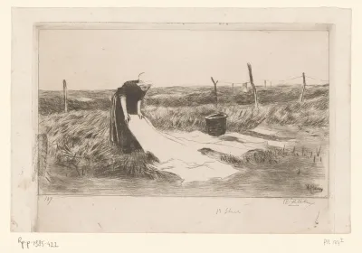 Vrouw doet de was in een weide