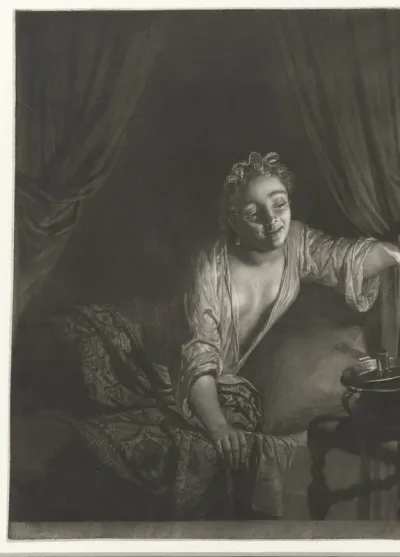 Vrouw in bed met een kaars