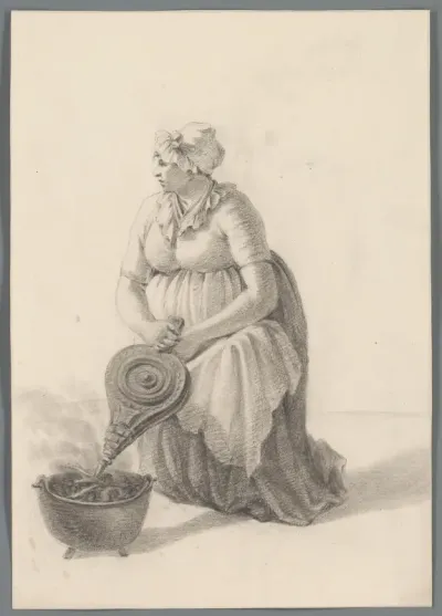 Vrouw wakkert een vuur aan met een blaasbalg