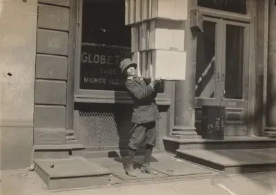 Wagon boy or "tail boy" helping to load the wagon