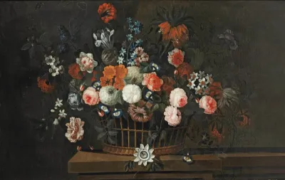 Wicker basket with roses, tulips, hyacinths and other flowers, on a wooden ledge