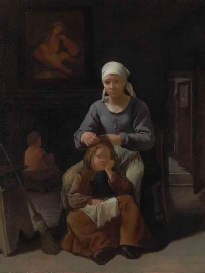 Woman in an interior delousing a child