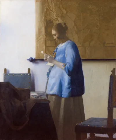 Woman in Blue Reading a Letter