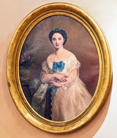 Woman in white with blue bow