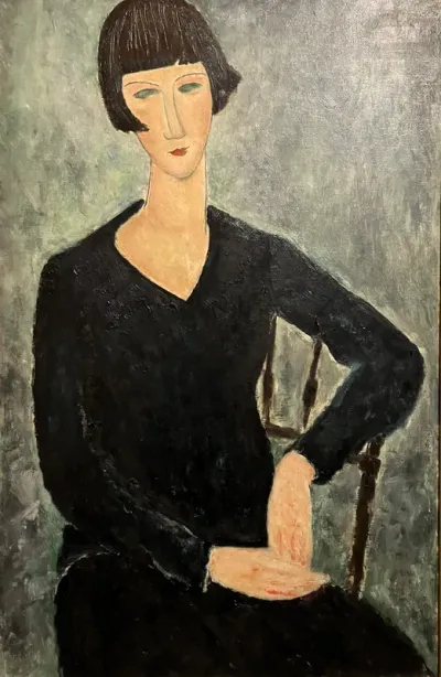 Woman seated in blue dress