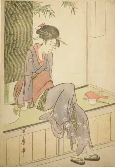 Woman Sitting on Veranda