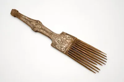 Wooden comb with ornamental carving