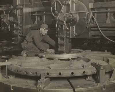 Worker at Grinding Machine