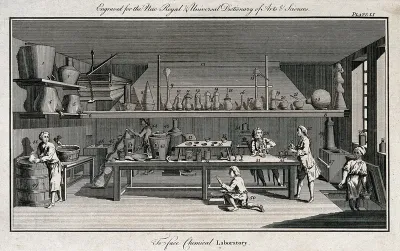 Workers using apparatus in a chemical laboratory