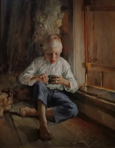 Young Boy Holding an Apple