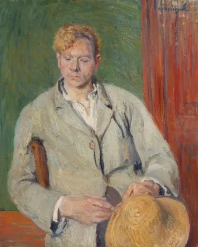 Young farmer holding his hat