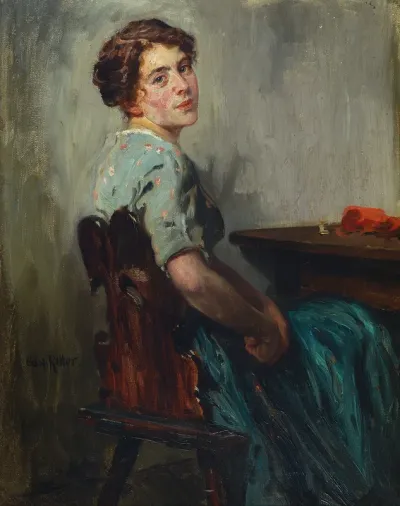 Young woman sewing at the table