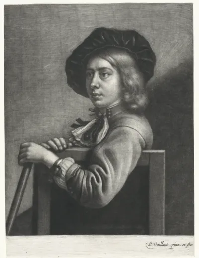 Zittende jongen met een baret