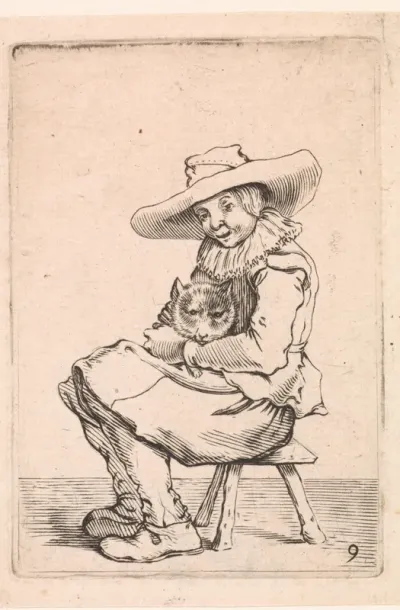 Zittende jongen met een poes op schoot