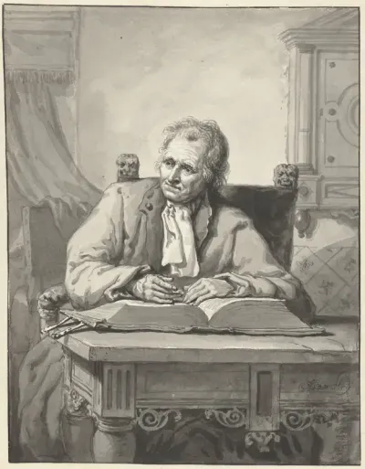 Zittende man aan een tafel met een opengeslagen bijbel