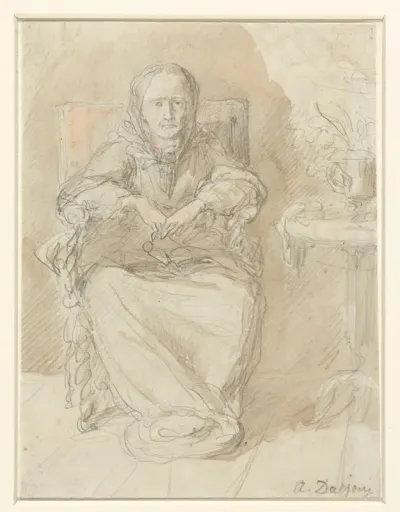 Zittende oude dame naast een tafel