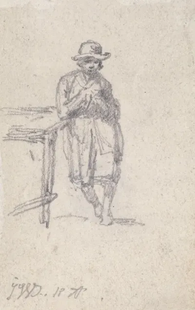 A Boy Leaning Against A Table