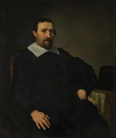 Portrait Of A Gentleman Seated At A Table