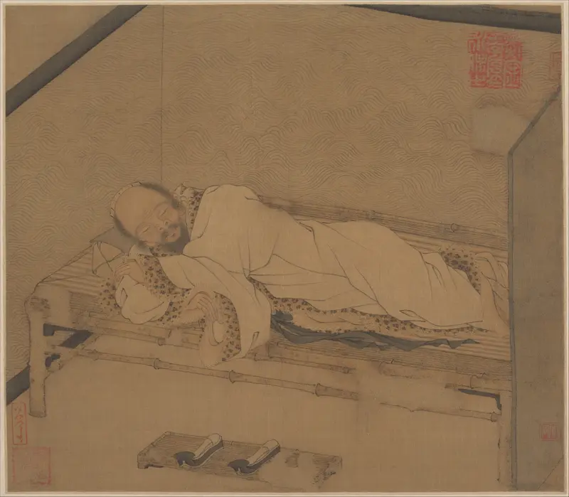 Man sleeping on a bamboo couch