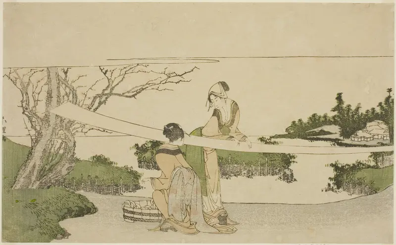Two women stretching cloth