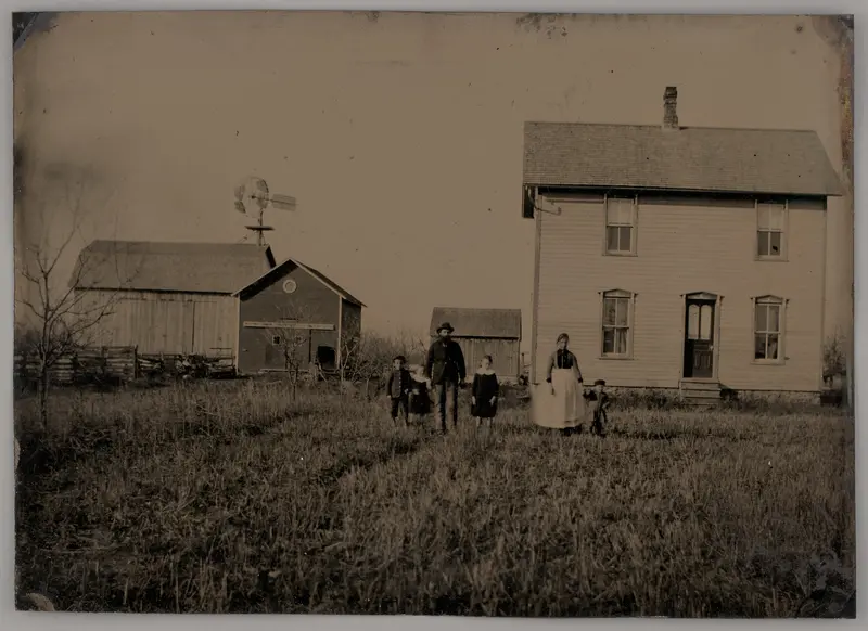 Untitled (A Man, a Woman, and Three Children Standing in Front of a Farmhouse)