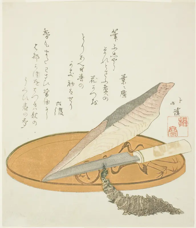 Wasabi root with dried bonito and knife on a lacquer tray
