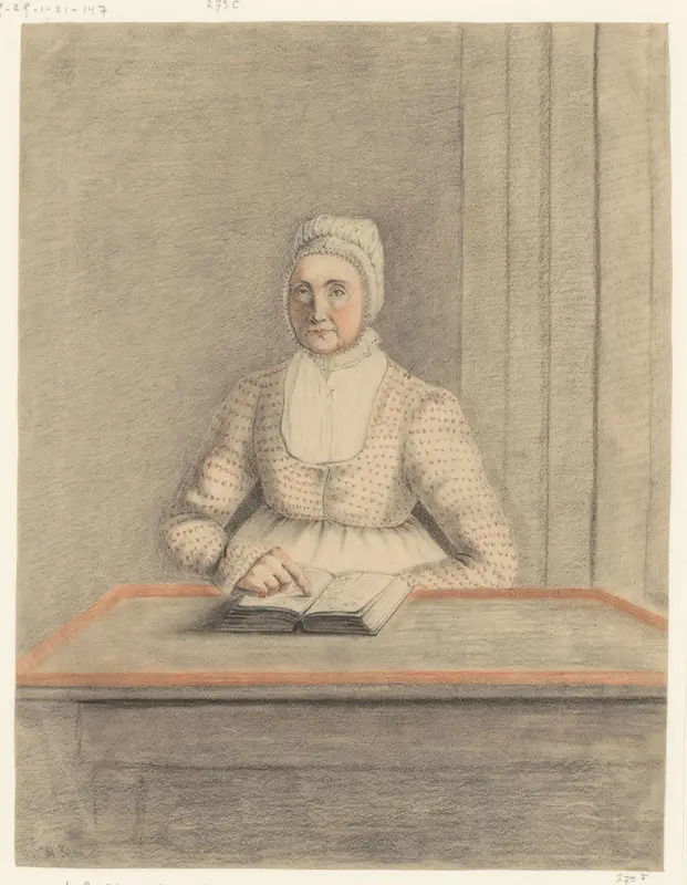 Zittende vrouw aan een tafel met open Wall Art by anonymous - High-Resolution Digital Print