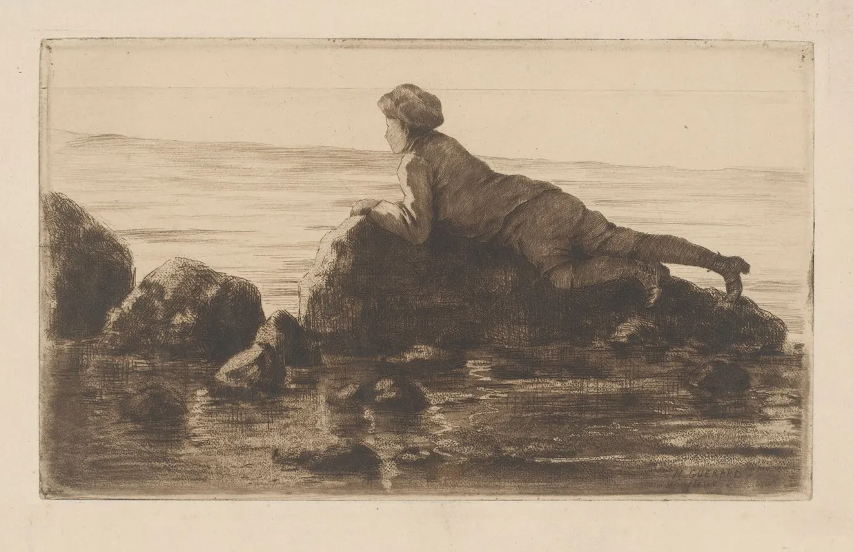 Boy Lying On Rocks On The Beach