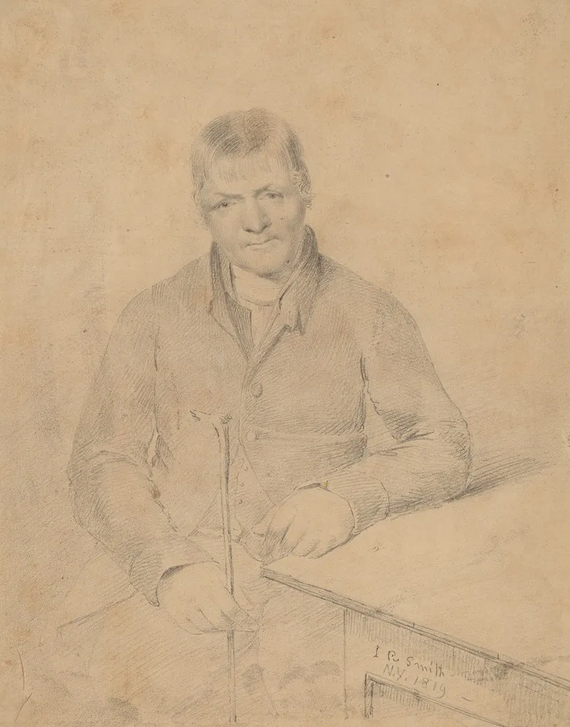 Man Seated At A Table