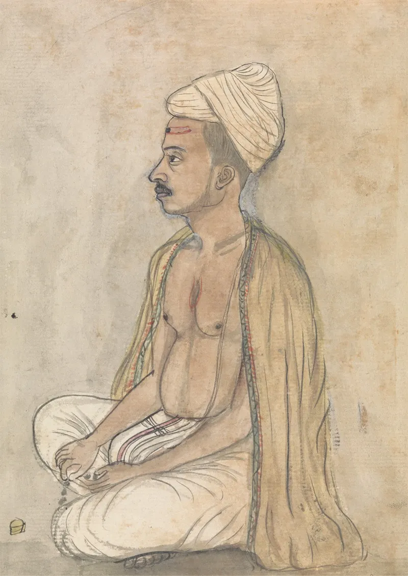 Man With A Yellow Shawl Sitting Crosslegged